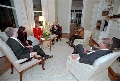 Vice President Dick Cheney and Lynne Cheney entertain Chief of Staff for the Vice President Lewis Libby (left) and his wife Harriet Grant (second on right) and former Vice President Dan Quayle (right) and his wife Marilyn Quayle (second on left) in the first floor library at the Naval Observatory Dec. 4, 2001. 