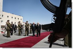 Vice President Dick Cheney and President Mahmoud Abbas of the Palestinian Authority walk through an honor cordon after the arrival Sunday, March 23, 2008, of the vice president to the West Bank city of Ramallah. White House photo by David Bohrer