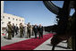 Vice President Dick Cheney and President Mahmoud Abbas of the Palestinian Authority walk through an honor cordon after the arrival Sunday, March 23, 2008, of the vice president to the West Bank city of Ramallah. White House photo by David Bohrer