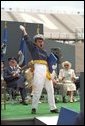 An exultant Air Force Academy graduate celebrates upon receiving his diploma during the U.S. Air Force Academy Commencement ceremonies at Falcon Stadium in Colorado Springs, CO May 30, 2001. White House photo by David Bohrer