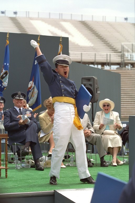 An exultant Air Force Academy graduate celebrates upon receiving his diploma during the U.S. Air Force Academy Commencement ceremonies at Falcon Stadium in Colorado Springs, CO May 30, 2001. White House photo by David Bohrer
