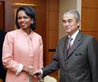 Secretary Rice shakes hands with Malaysian Prime Minister Abdullah Badawi, Kuala Lumpur, Malaysia, July 27, 2006. US Embassy photo.