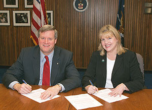 OSHA's Assistant Secretary, Edwin G. Foulke, Jr. and Paula Graling, President, AORN sign national Alliance agreement on December 15, 2006.