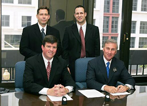 (seated left to right) OSHA’s then-Acting Assistant Secretary, Jonathan L. Snare, and ISSA’s Vice President/President Elect, Bobby Cohen (standing left to right) Bill Balek, ISSA’s Director of Legislative Affairs and Dan Wagner, ISSA’s Manager of Regulatory Compliance, after the Alliance signing.