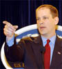 Sean McCormack at podium in Department briefing room