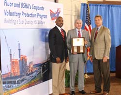 Deputy Assistant Secretary Donald G. Shalhoub (center) presents Dwayne Wilson, Group President, Industrial & Infrastructure (Left) and Garry Flowers, Sr. Vice President, Corporate Security and Construction Services (Right) with a plaque recognizing Fluor Corporation as a VPP Corporate participant.