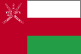 Flag of Oman is three horizontal bands of white, red, and green of equal width with a broad, vertical, red band on hoist side; the national emblem in white is centered near top of vertical band.