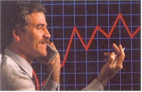 Picture of a man talking on the phone and looking at a graph
