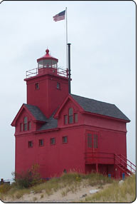 Secretary of the Interior Dirk Kempthorne recently signed official papers that will transfer Holland Harbor South Pierhead Light in Michigan to the Holland Harbor Lighthouse Historical Commission. Dubbed 'Big Red,' the fire-engine-colored lighthouse is a well known sight where Black Lake (Macatawa Lake) empties into Lake Michigan.