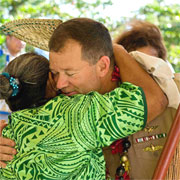 A local woman hugs Capt. John Shaub, deputy Pacific Partnership 2009 mission commander, at a ribbon cutting ceremony celebrating the renovation of the assembly hall at the Sasina Primary School