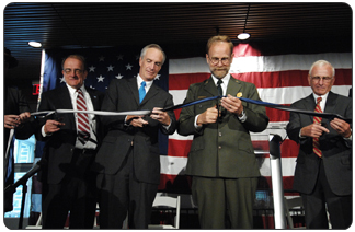 Michael Breis sings the Star-Spangled Banner at Yellowstone 90th Anniversary Celebration. Standing from left to right are Secretary Kempthorne, Director Mainella, Senator Thomas, and Superintendent Lewis.