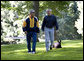 President George W. Bush and Chief of Staff Josh Bolten walk together with the President's dog, Barney, at Camp David, Saturday, July 21, 2007. White House photo by Eric Draper