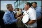 President George W. Bush greets military personnel at the Willow Grove Naval Air Station in Pennsylvania before boarding Air Force One en route to Johnstown, Pa., Thursday, Sept. 9, 2004.  White House photo by Tina Hager