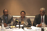 Amb. Eric Bost, Assistant Secretary Jendayi Frazer, and Amb. James McGee take questions after meeting on a variety of issues in Pretoria, South Africa.  AP Image.