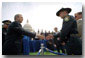 President George W. Bush greets a police officer from Flagstaff, AZ., after placing a wreath to commemorate the 20th Annual Peace Officers Memorial Service at the Capitol.