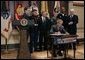 President George W. Bush signs H.R.4613, The Defense Appropriations Act for Fiscal Year 2005, in the Dwight D. Eisenhower Executive Office Building Thursday, Aug. 5, 2004.   White House photo by Eric Draper