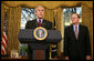 With Michael McConnell, Director of National Intelligence, looking on, President George W. Bush delivers a statement on the Protect America Act Wednesday, Feb. 13, 2008, in the Oval Office of the White House. Said the President, "It is time for Congress to ensure the flow of vital intelligence is not disrupted. It is time for Congress to pass a law that provides a long-term foundation to protect our country. And they must do so immediately."  White House photo by Joyce N. Boghosian