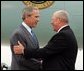 President George W. Bush chats with Freedom Corps greeter Charlie Graas after touching down in Springfield, Missouri on Friday July 30, 2004.  White House photo by Paul Morse