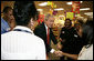 President George W. Bush meets employees at a pharmacy in Washington, D.C. Friday, Oct. 20, 2006, during a visit to the store where he talked about the Medicare Part D Plan. "Our seniors are saving money, they're getting better coverage," said the President. "It's a plan that I'm real proud of."  White House photo by Kimberlee Hewitt