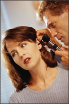person having their ear examined