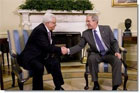 President George W. Bush and President Mahmoud Abbas exchange handshakes Thursday, Sept. 25, 2008, during their visit in the Oval Office of the White House. White House photo by Eric Draper