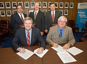 (First row seated L-R) Edwin G. Foulke, Jr., Assistant Secretary, USDOL-OSHA; Kenny Jordan, Executive Director, AESC; (Second row L-R) John Vidrine, Chairman, Health, Safety and Environmental Committee, AESC; Pete Sandel, Chairman, Executive Committee, AESC; Bob Stone, Member, AESC; sign a national Alliance renewal agreement on May 21, 2007.