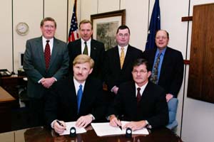 Front row: IWLA President and CEO Joel R. Hoiland and OSHA's then-Assistant Secretary of Labor, John Henshaw. Back row: Pat O'Connor, IWLA Washington Representative, Paul Delp, Warehouse Co., Inc. and Logistics Services, Inc., Nathan Noy, IWLA's Director of Government and Legal Services, Landsdell C. McRoberts, Airfreight Warehouse Corporation.