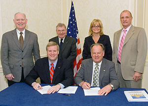 (front row) Edwin G. Foulke, Jr., Assistant Secretary, USDOL-OSHA; Paul Mikkola, President, AFS; (back row, L-R) Tom Slavin, Manager, Safety and Health, Navistar International Corporation; Jack Wymer, Vice President, Fairmount Minerals; Stephanie Salmon, AFS, Washington DC Office; Fred H. Kohloff, Director, Environmental, Health and Safety, AFS at the national Alliance renewal signing on April 11, 2008