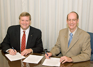 From L-R: OSHA's Assistant Secretary, Edwin G. Foulke, Jr., and AIHA’s President, Frank M. Renshaw, renew national Alliance agreement on July 6, 2006.