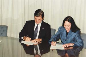 OSHA's then-Assistant Secretary, John Henshaw, and AIHA's Gayla J. McCluskey
