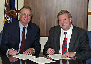 From L-R: ADA's President, Dr. Robert M. Brandjord, and OSHA's Assistant Secretary, Edwin G. Foulke, Jr., renew national Alliance agreement on May 18, 2006
