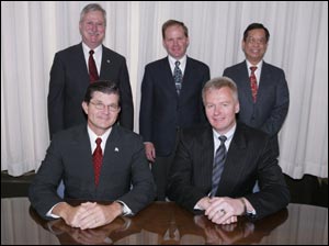 1st row: OSHA’s then-Assistant Secretary of Labor John Henshaw, and Dirk Van Holt, President of the US operation of Jungheinrich/Multion and President of the Industrial Truck Association (ITA). 2nd row: William Montwieler, Executive Vice President, ITA, Christopher Merther, Manager, Technical Programs, ITA and Long Loo, OSHA.