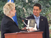 Deputy Assistant Secretary of State, Christy McCampbell, presents an award for Salvadoran support and assistance to Minister for Public Security, Rene Figueroa, at the groundbreaking ceremony for the new campus of the International Law Enforcement Academy in San Salvador.