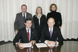 Back row L-R: AHA's Richard S. Hamburg, Robin M. McCune, and Kelly Kennai Grunig. Front row L-R: OSHA's then-Assistant Secretary, John Henshaw, and AHA's M. Cass Wheeler sign national Alliance November 20, 2003.