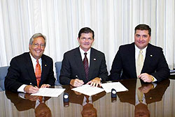(L-R) Bruce D'Agostino, Executive Director, CMAA; OSHA's then-Assistant Secretary, John Henshaw and Ted Devens, CMAA, sign an Alliance renewal on July 28, 2004.
