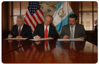 Carlos Fión, Chief of Staff to the President of Guatemala, Dirk Kempthorne, Secretary of the U.S. Department of the Interior, and 

 Salvador Lopez, Director of Culture for the Guatemala Ministry of Culture and Sports, sign 

Understanding for a partnership that will help promote sustainable development in Guatemala. 