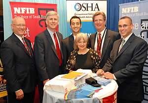 From left to right: Jeff Koch, Vice President, Member Benefits, NFIB; Todd Stottlemyer, President and CEO, NFIB; George Yogurtian, Program Manager, Arizona, NFIB; Susan FitzHenry, Manager, Member Benefits, NFIB; Bill Willson, Program Analyst, Office of Outreach Services and Alliances, Directorate of Cooperative and State Programs, USDOL-OSHA; and Thomas Head, Manager Sales and Product Development, Member Benefits, NFIB; in the NFIB and OSHA exhibit booth at the 2006 NFIB Small-Business Summit