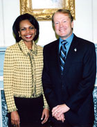 Secretary Rice stands with Award for Corporate Excellence winner John T. Chambers, President and CEO, Cisco Sysstems, Inc.  State Department photo