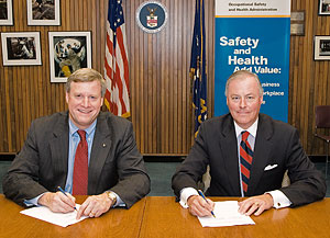 OSHA's Assistant Secretary, Edwin G. Foulke, Jr. and AMI's President and CEO, J. Patrick Boyle, renew the national Alliance agreement on September 27, 2006.