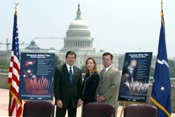 (left to right) OSHA's then-Assistant Secretary John Henshaw, APA's Executive Director, Julie Heckman, and APA President Michael Collar pose with OSHA/APA Alliance-developed Fireworks Safety Posters after the signing ceremony.