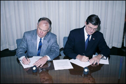 From L-R: Independent Electrical Contractors, Inc.'s National President, J.B. Wise, and OSHA's then-Assistant Secretary, John Henshaw, sign Alliance renewal.