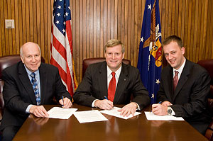 (L-R) National Chicken Council's President, George B. Watts, OSHA’s Assistant Secretary, Edwin G. Foulke, Jr. and National Turkey Federation's Director of Scientific and Regulatory Affairs, Michael Rybolt sign a national Alliance agreement on November 15, 2007