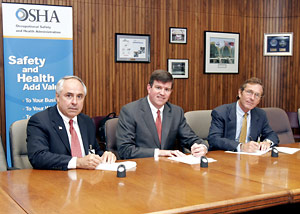 (L-R) David Carter, SWRI Chairman Alliance Committee; OSHA's then-Deputy Assistant Secretary Jonathan L. Snare and Michael Ahearn, SWRI President sign Alliance renewal agreement on July 21, 2005.