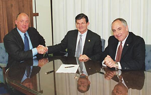 (L-R) SWRI's President, Robert Forrer, OSHA's then-Assistant Secretary, John Henshaw, and SWRI's President elect, David Carter, sign national Alliance on February 20, 2003.