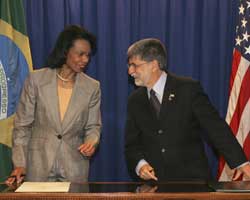 Secretary Rice and Brazilian Foreign Minister Celso Amorim sign an advance biofuel agreement between their two countries,  March 9, 2007, in Sao Paulo, Brazil. (AP Photo/Lawrence Jackson)