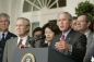 President Bush stands with Secretary Chao; Secretary of Defense Donald Rumsfeld; and Mike Leavitt, Secretary of Health and Human Services.