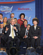 Secretary Chao and President George W. Bush are joined at the Northern Virginia Community College in Annandale, Va. by senior citizens in the Asian Pacific American community.