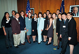 Secretary Chao, center, surrounded by DOL Summer 2002 interns.