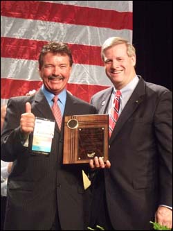 Assistant Secretary Edwin G. Jr., presenting SGE award to Larry Shaffer