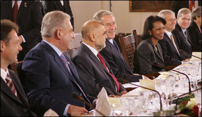 President George W. Bush smiles as he participates in a working lunch with future NATO leaders Saturday, April 5, 2008, in Zagreb. Next to him is President Stjepan Mesic of Croatia.